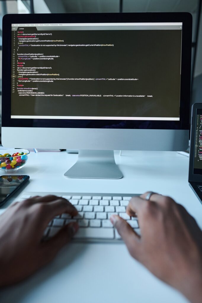 Developer typing codes on computer